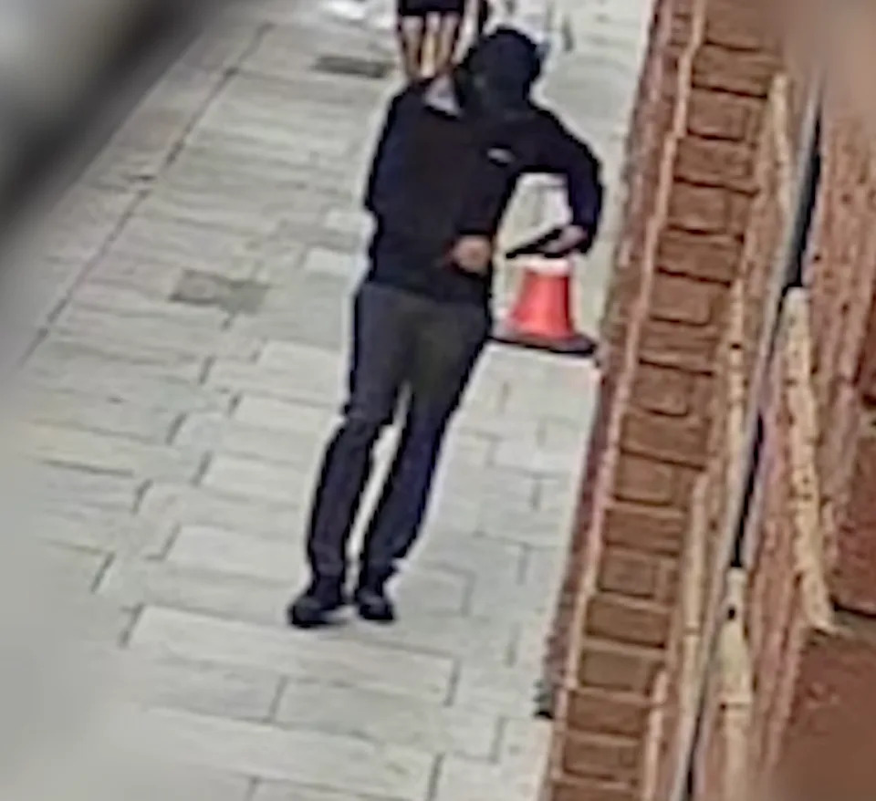 CCTV shows the moment the masked gunman walked calmly into the park before shooting Rene Graham, 15, in the chest in front of hundreds at a family fun day (Metropolitan Police)