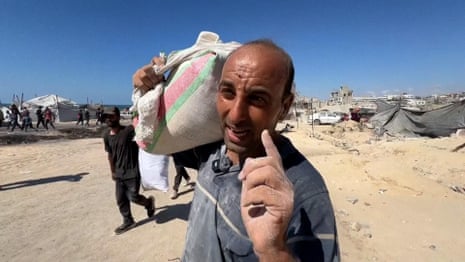 'Suddenly they fired': Palestinians tell of desperate search for bags of flour – video