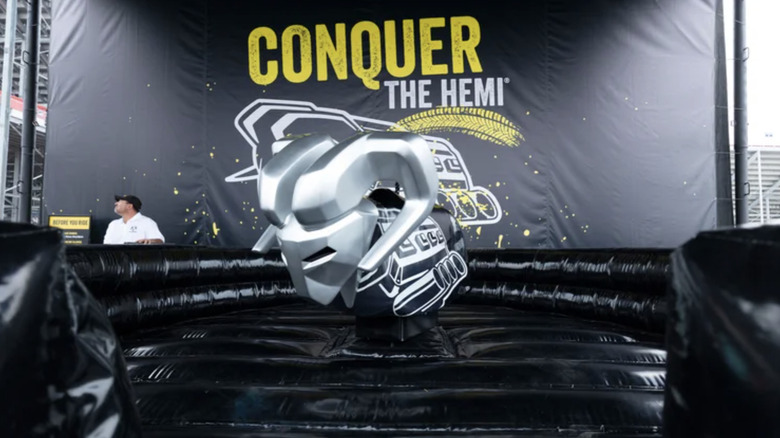 The ram mechanical bull ride surrounded by black inflatable protective material andwith the word 