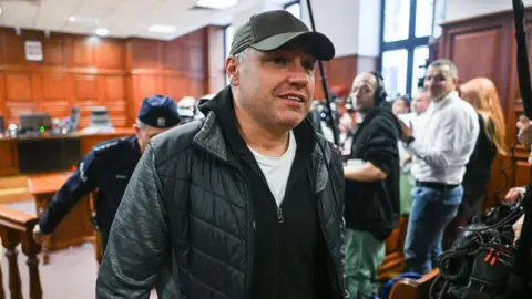 Omar Marques/Getty Images Ukrainian diver, Volodymyr Zhuravlyov, who is wanted by Germany under an European Arrest Warrant over his alleged involvement in the 2022 underwater explosion of the Nord Stream pipeline, walks free from the court room