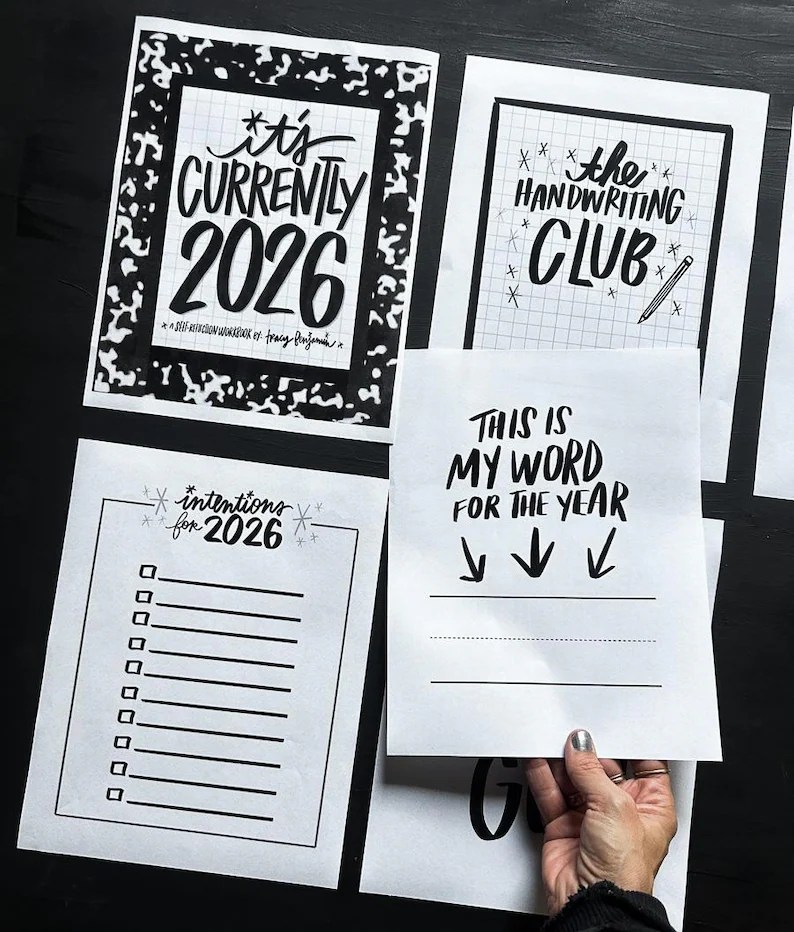 May include: A collection of black and white stationery items. One sheet reads "It's Currently 2026" in bold lettering. Another says "The Handwriting Club" with a pencil illustration. Additional sheets include "intentions for 2026" and "This is my word for the year."