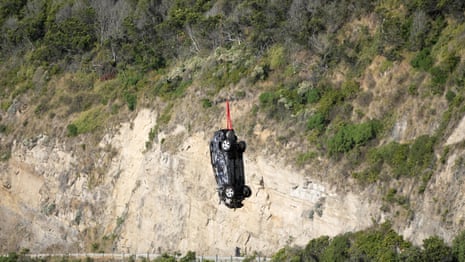 Cars washed out to sea on Great Ocean Road during flash flooding recovered by helicopter – video