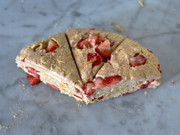 strawberry scone dough cut into wedges prior to baking