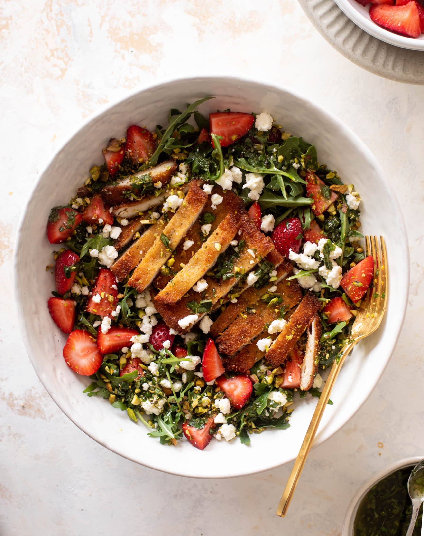 strawberry pistachio salad with crispy chicken