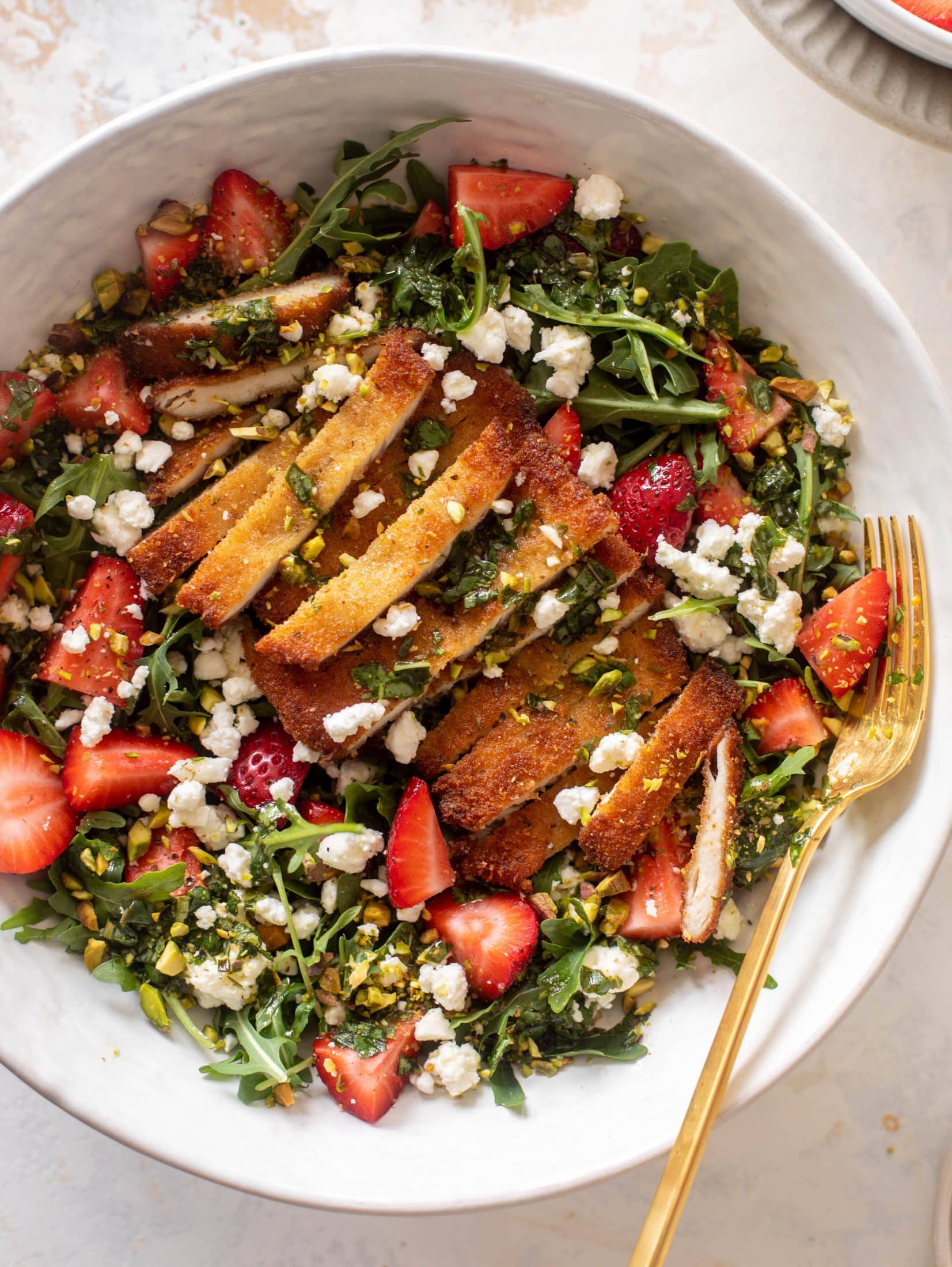 strawberry pistachio salad with crispy chicken