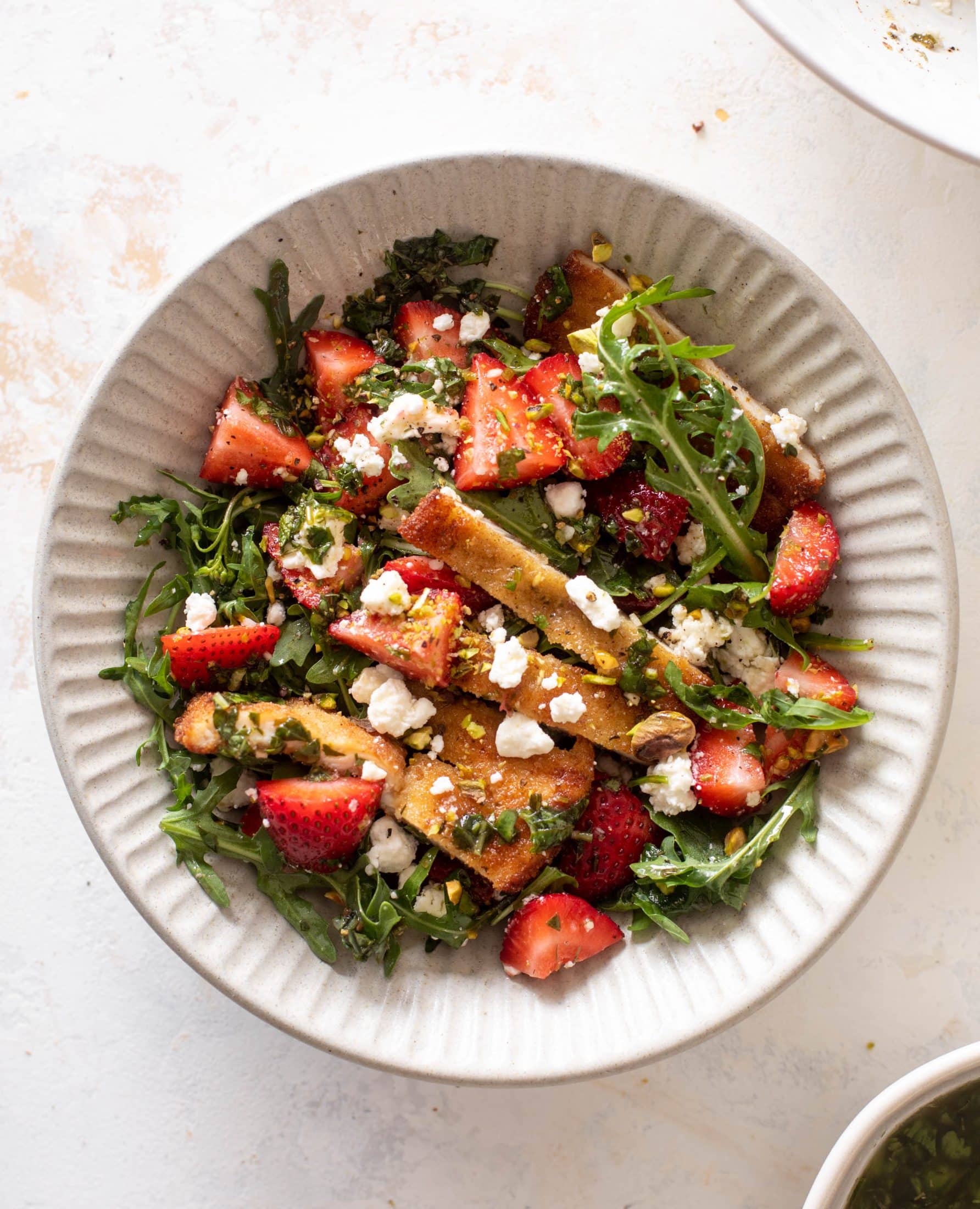 strawberry pistachio salad with crispy chicken