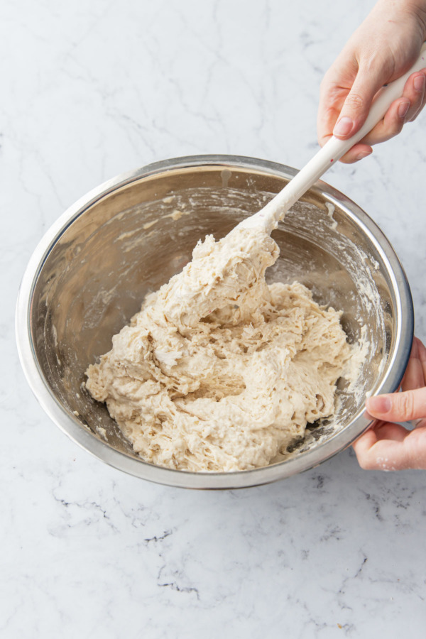The mixed dough will have a sticky, shaggy texture.