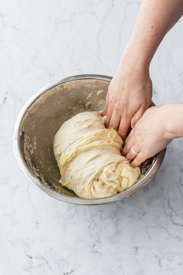 After stretching, fold the dough back over itself.